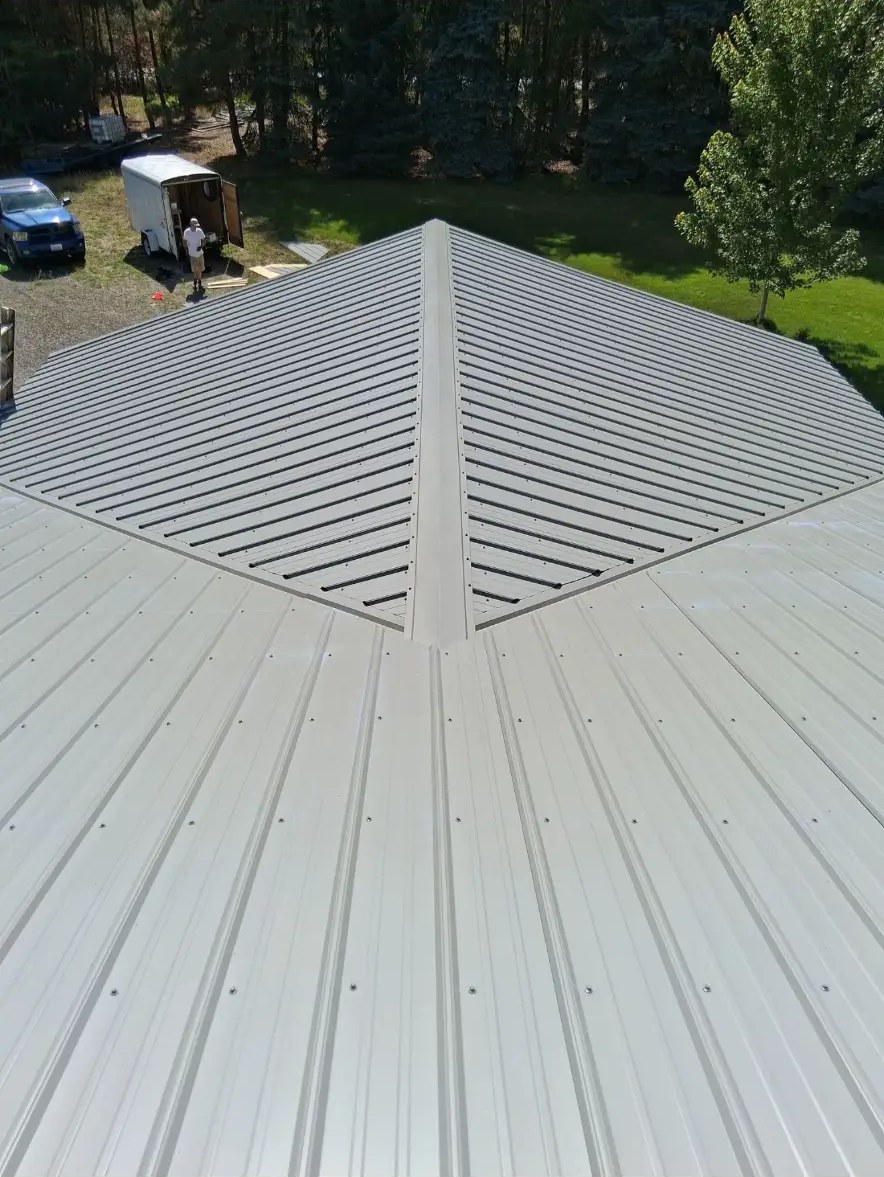 Aerial view of a freshly installed standing seam metal roof